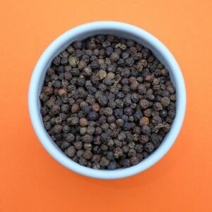 Black peppercorns in a bowl